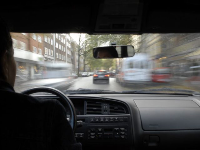 Car speeding along a road, view out of windscreen from vehicle interior