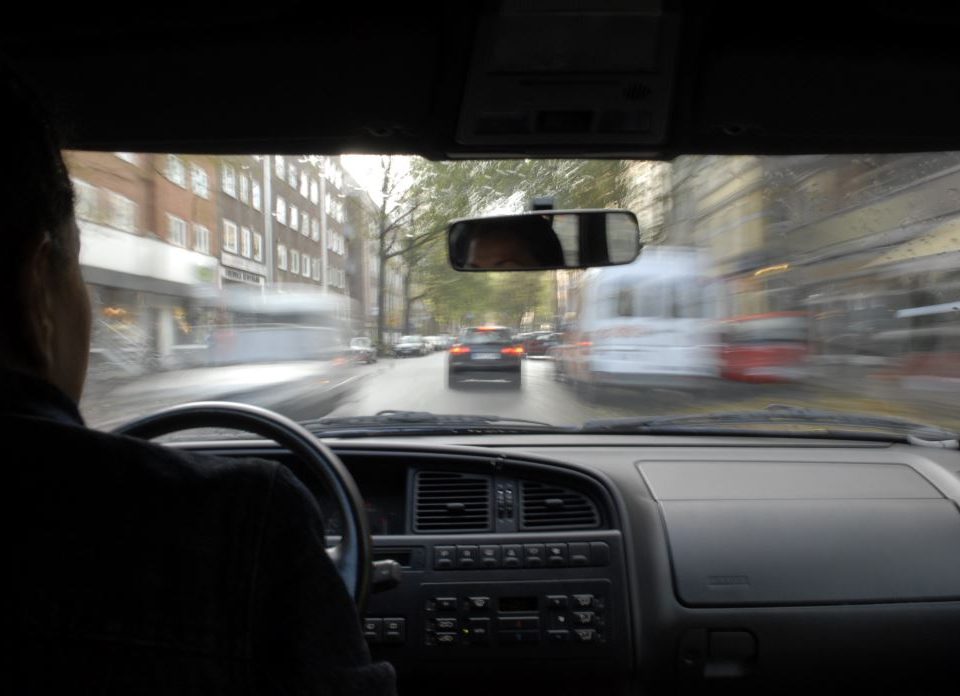 Car speeding along a road, view out of windscreen from vehicle interior