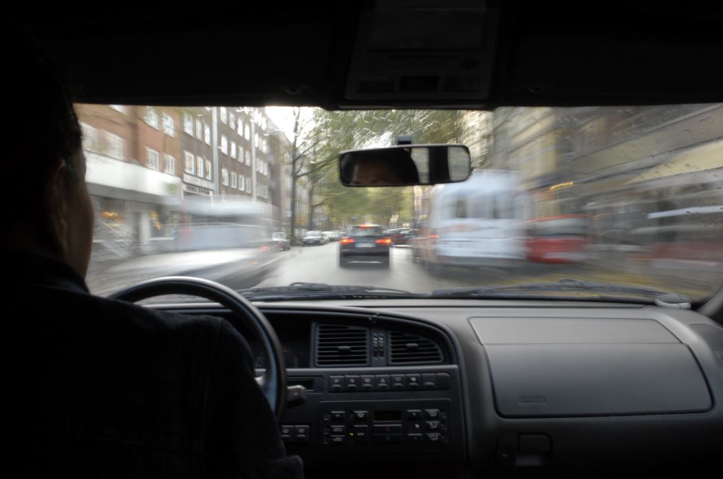 Car speeding along a road, view out of windscreen from vehicle interior
